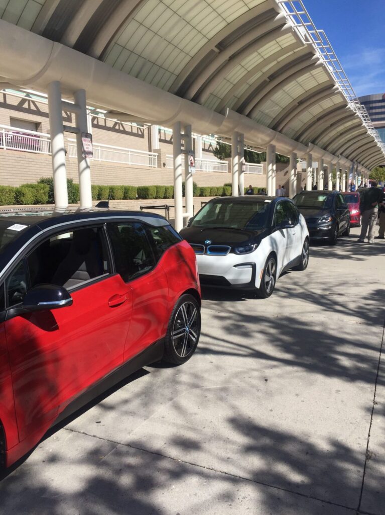 Electric vehicles parked outside next to curb