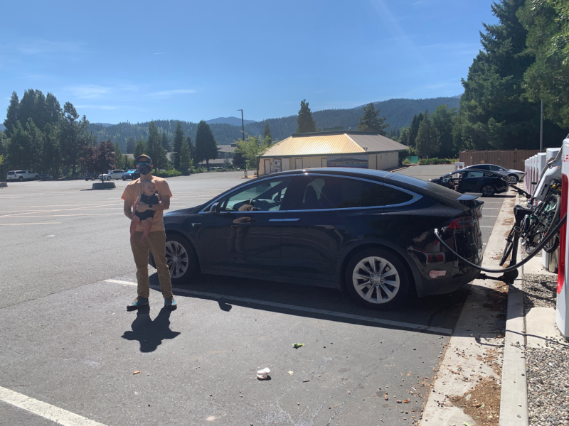 JEFF AND GRANGER – YOUR UNRELIABLE NARRATOR AND HIS BABY SON AT ONE OF MOUNT SHASTA’S TWO (!) SUPERCHARGERS.